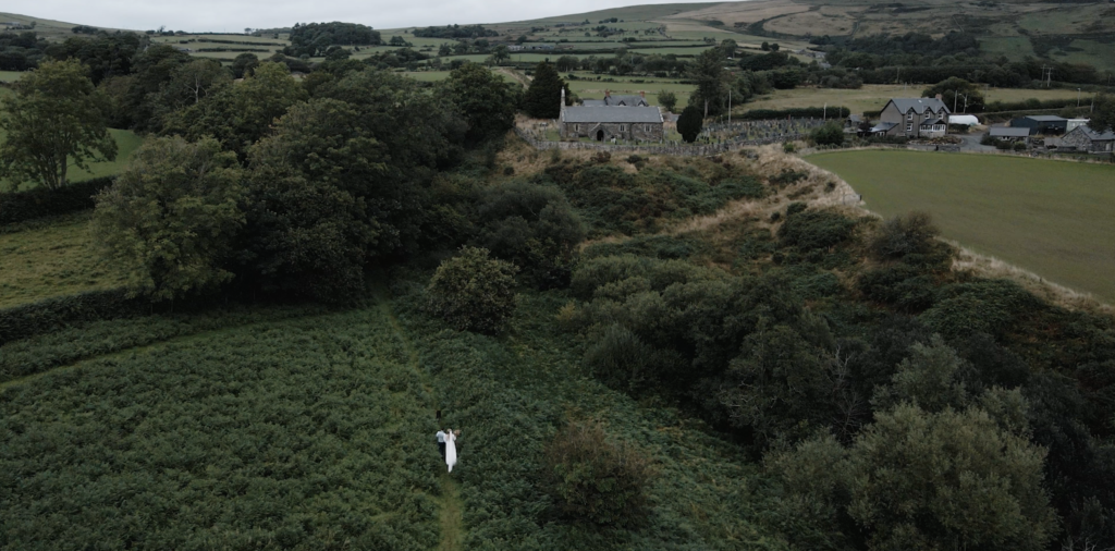 Drone shot Tywyn with bride and groom