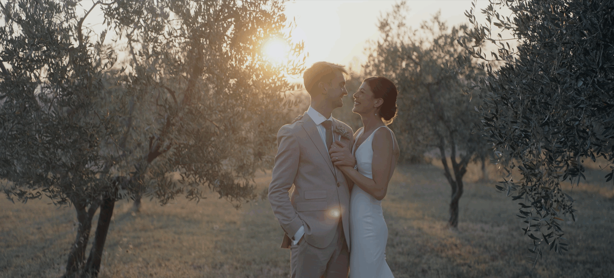 Couple during sunset in olive groves,Tuscany